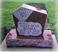 The front door of a house with a porch and plants in front of it.