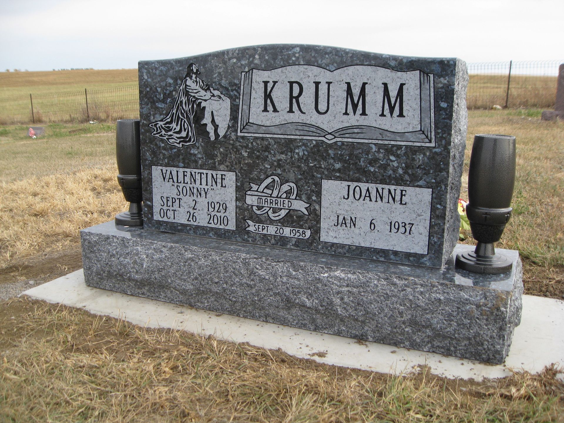 Headstone, Krumm family, with engraved names and dates, in a cemetery.