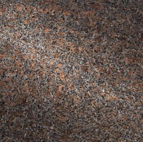 Close-up of a mottled granite surface with red-brown and gray speckles.