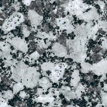Close-up of granite surface, showing large white and dark gray mottled pattern.
