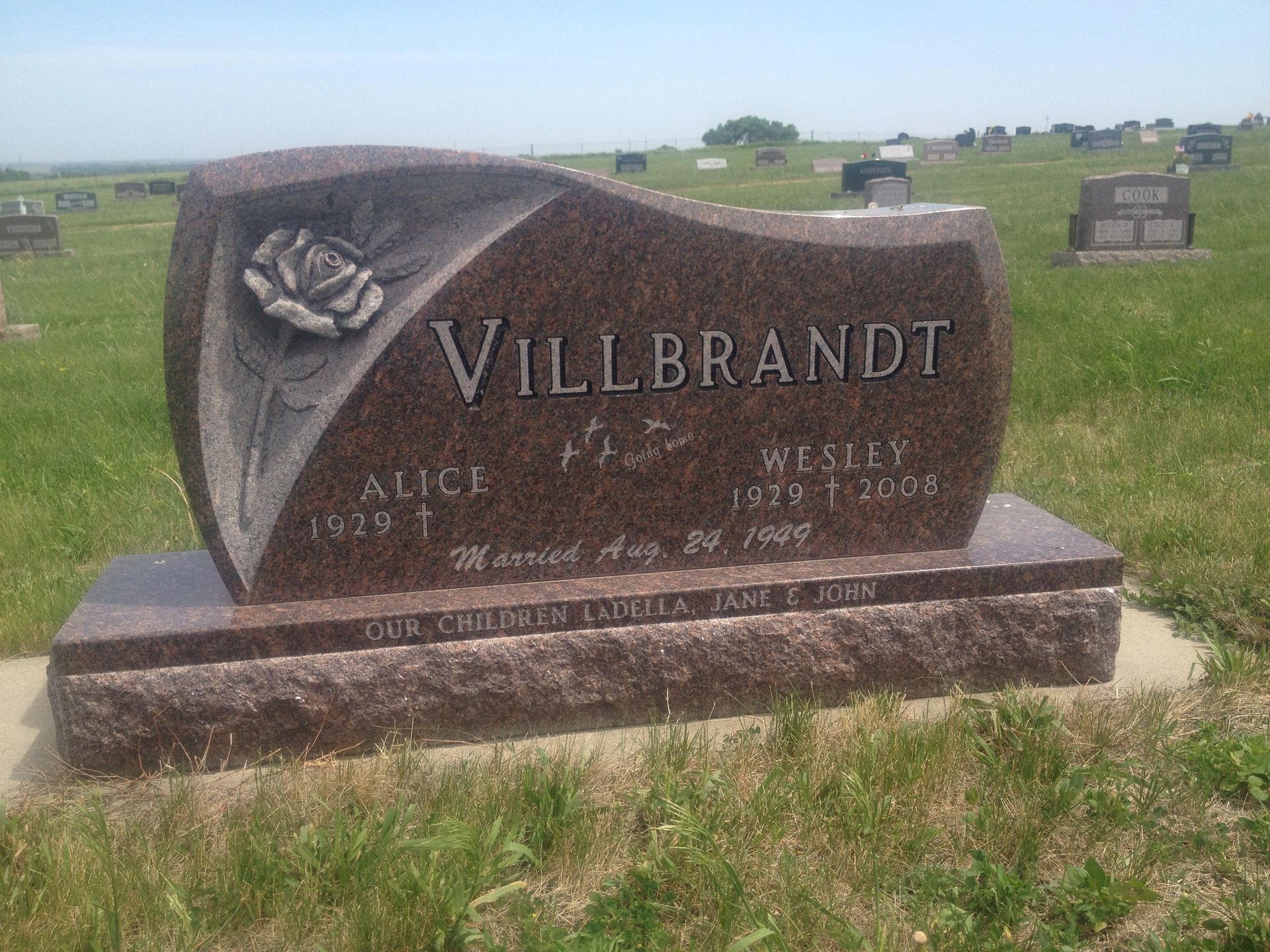 Gravestone with rose design;