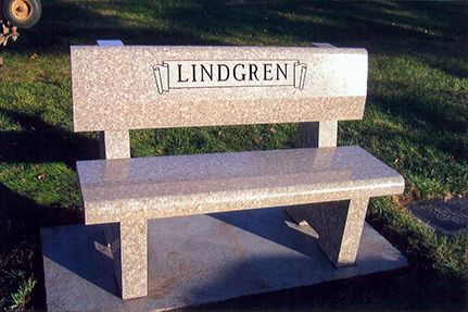 Granite bench in a grassy area with