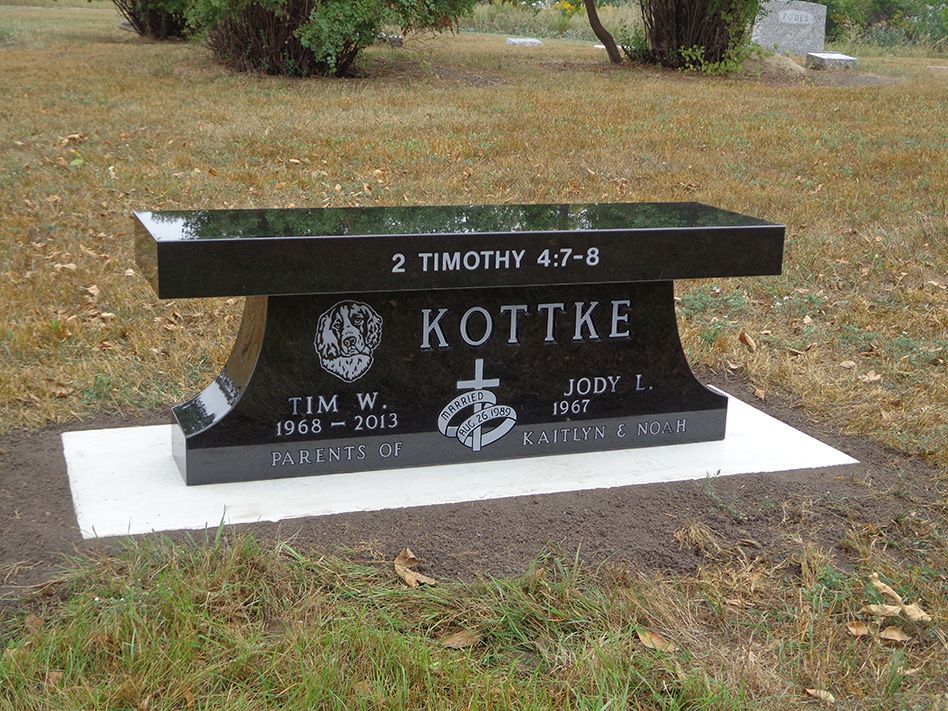 Black granite bench monument with inscription