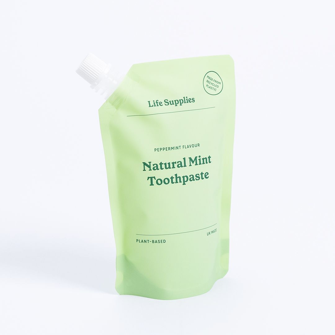 A bag of natural mint toothpaste with a white cap