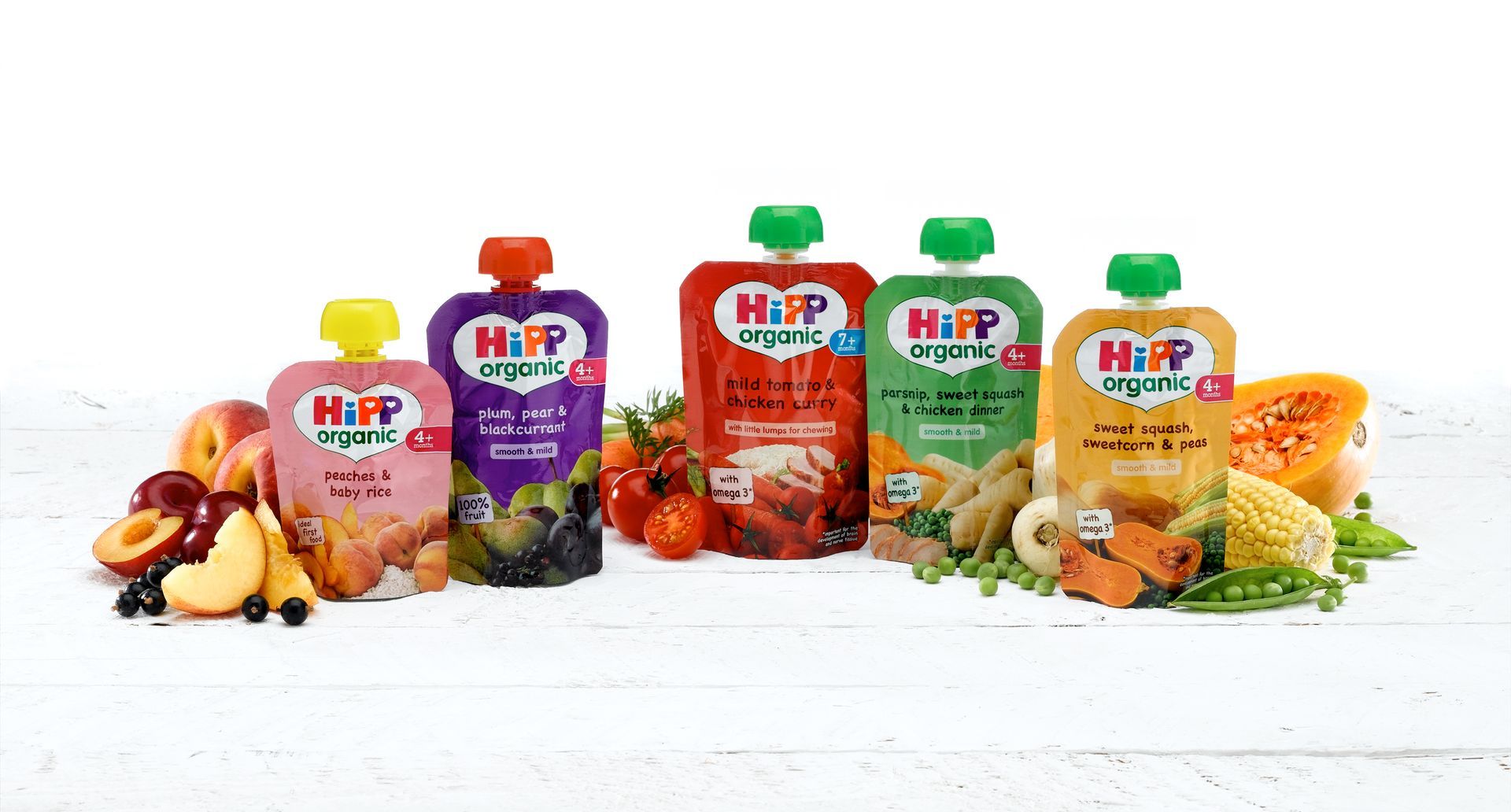 A group of baby food pouches sitting next to each other on a table.