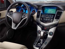 The interior of a car with a steering wheel and dashboard.