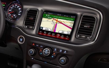 The dashboard of a dodge charger with a navigation system.
