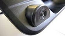 A close up of a rear view camera on a car.