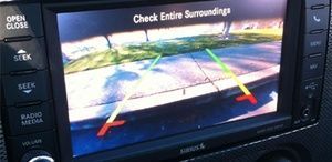 A close up of a rear view camera on a car dashboard.