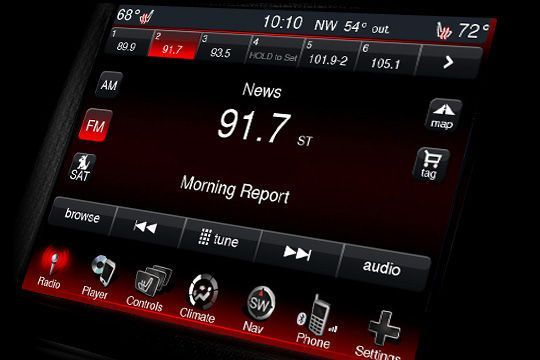 A car radio displays the morning report on 91.7