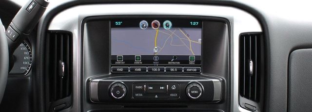 The dashboard of a car with a navigation system on it.