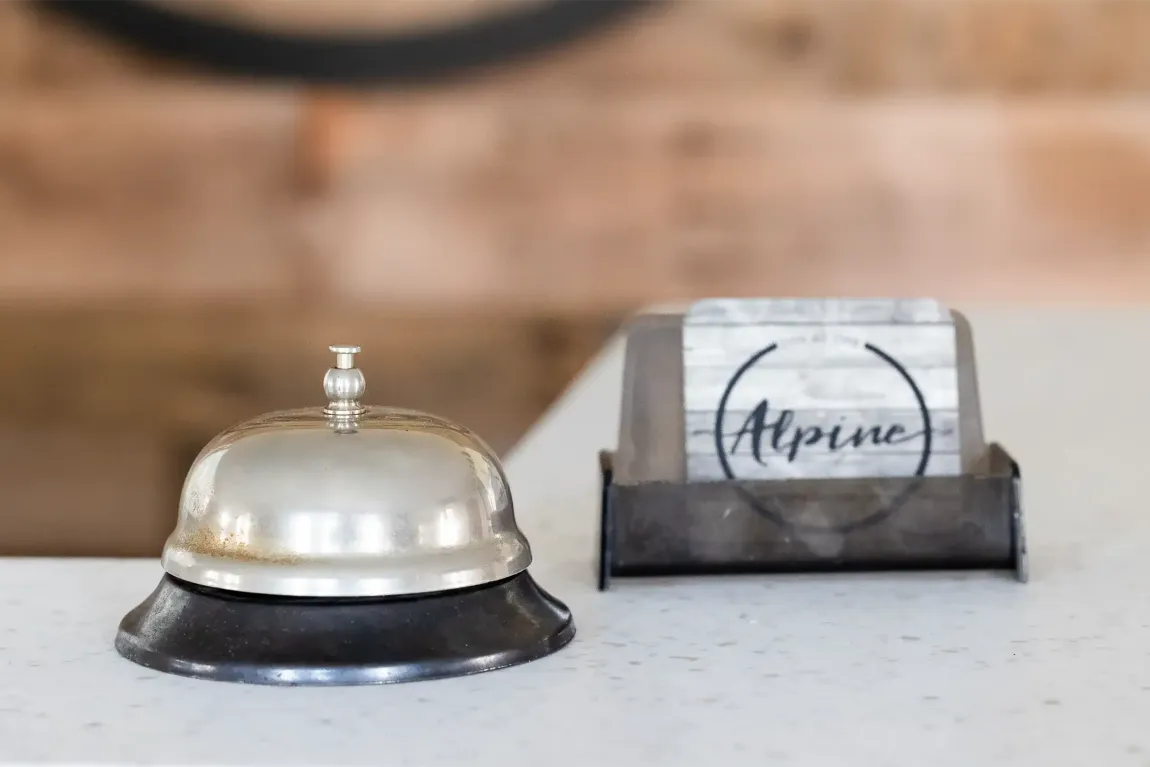 A bell and a card with the word alpine on it