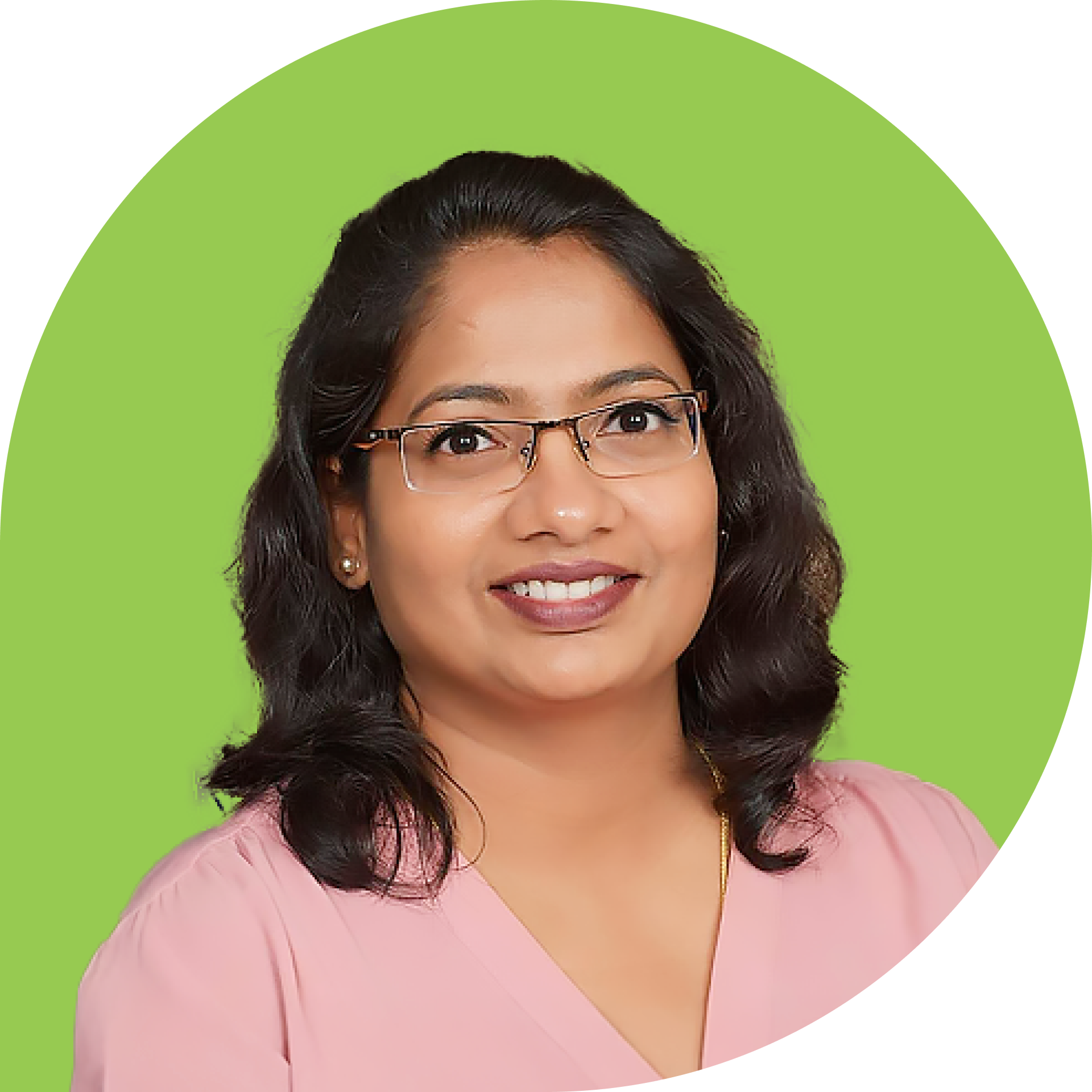 A woman with long black hair is wearing a yellow shirt and smiling.