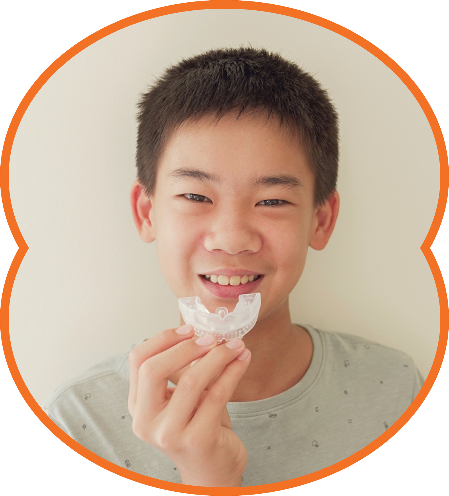 Child in a dentist's chair, mouth open, receiving dental work; blue setting.