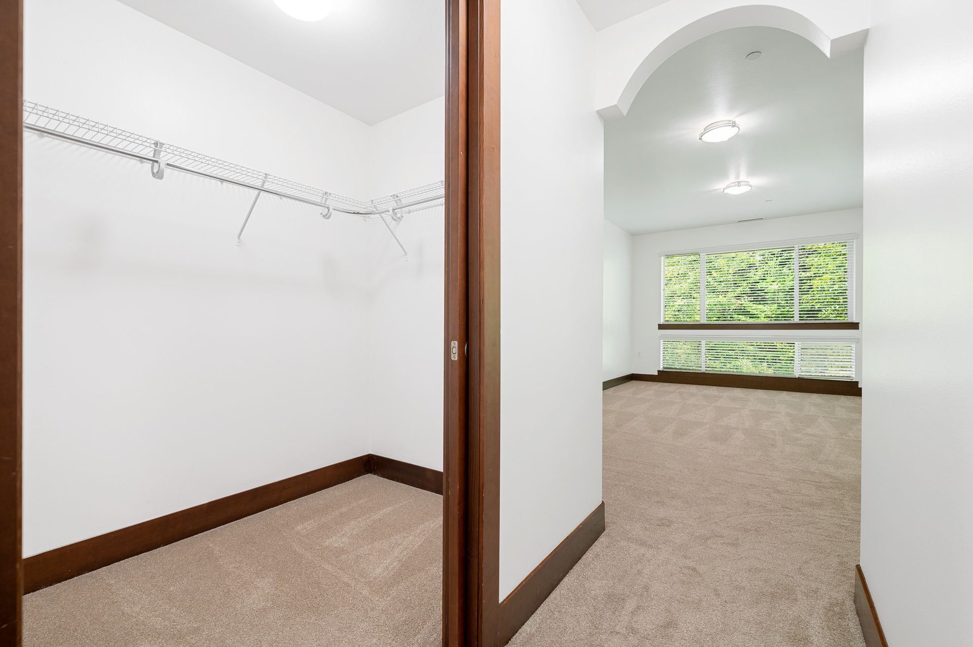 Photo of a large walk-in closet and plenty of natural lighting in the room