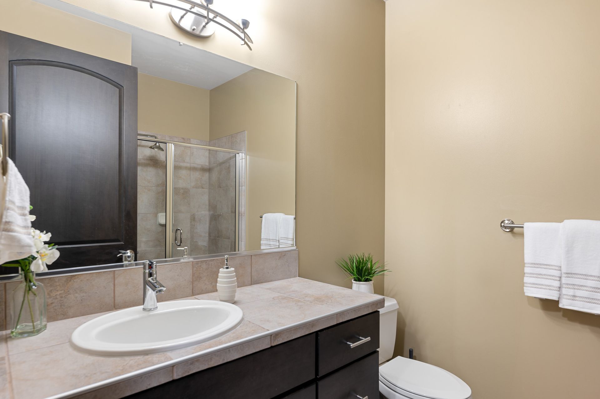 Photo of a bathroom with a wide vanity mirror