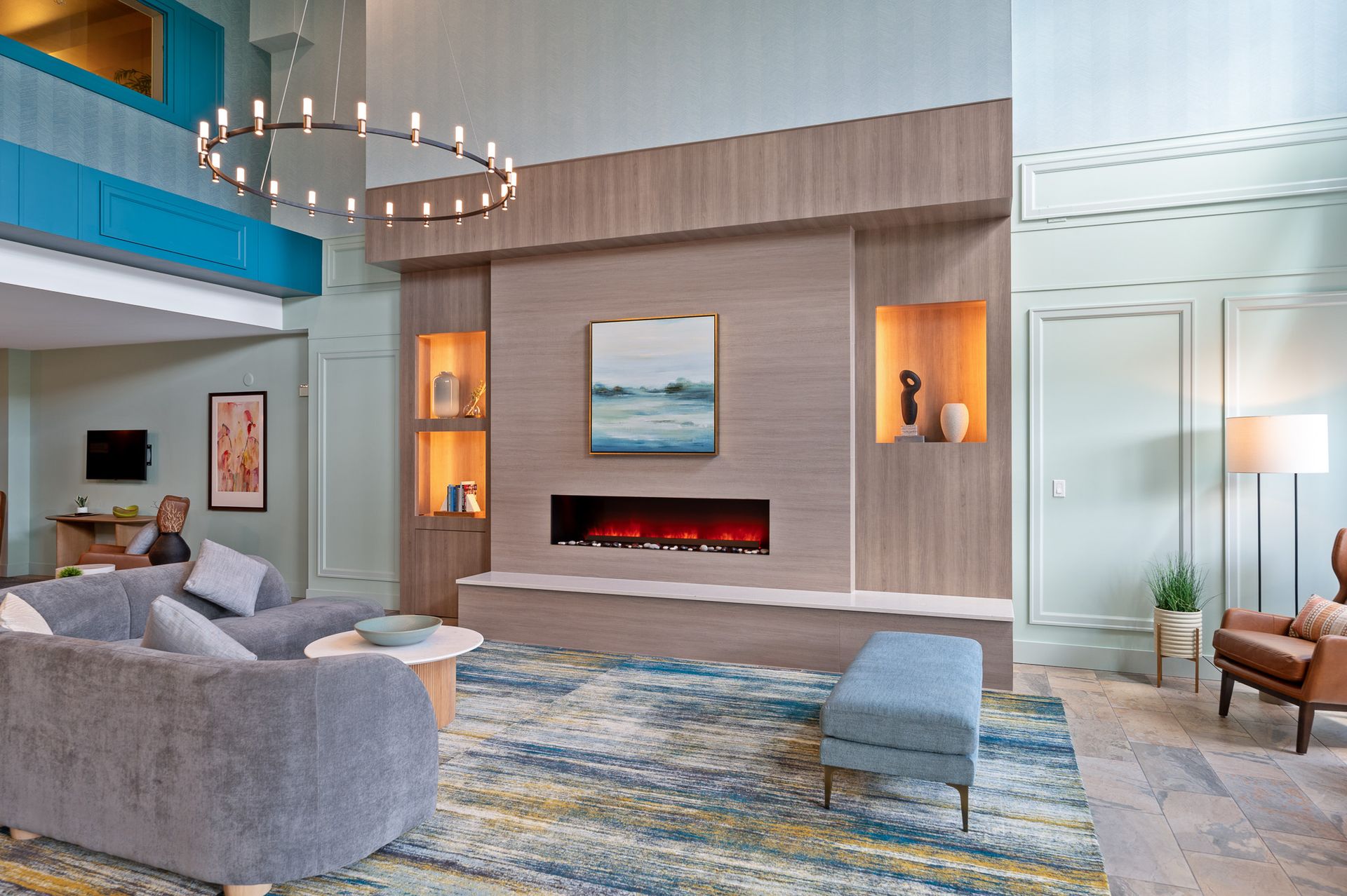 Photo of the sitting area in the lobby, with a chandalier-kind of light above