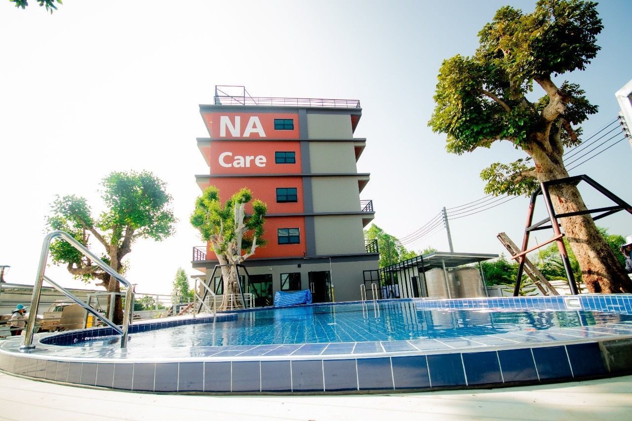 NaCare Hotel building and swimming pool