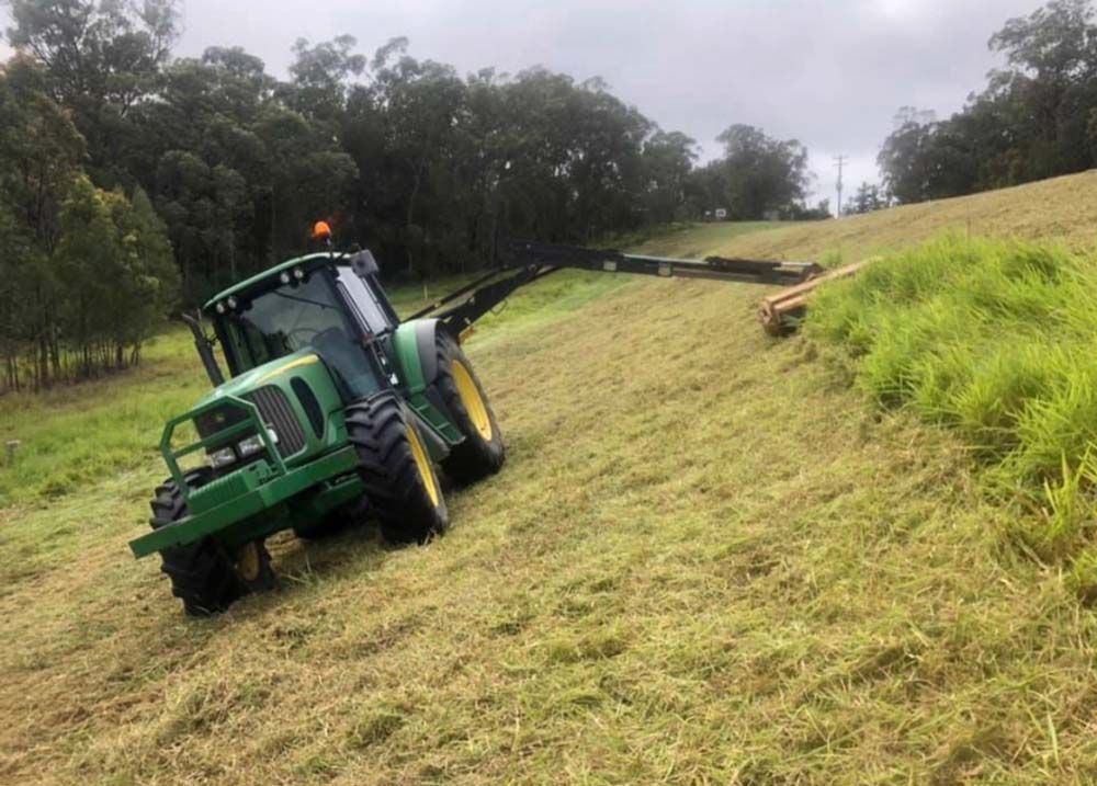 Mowing Grass Slant FIeld — J.A. Slashing in Cairns, QLD
