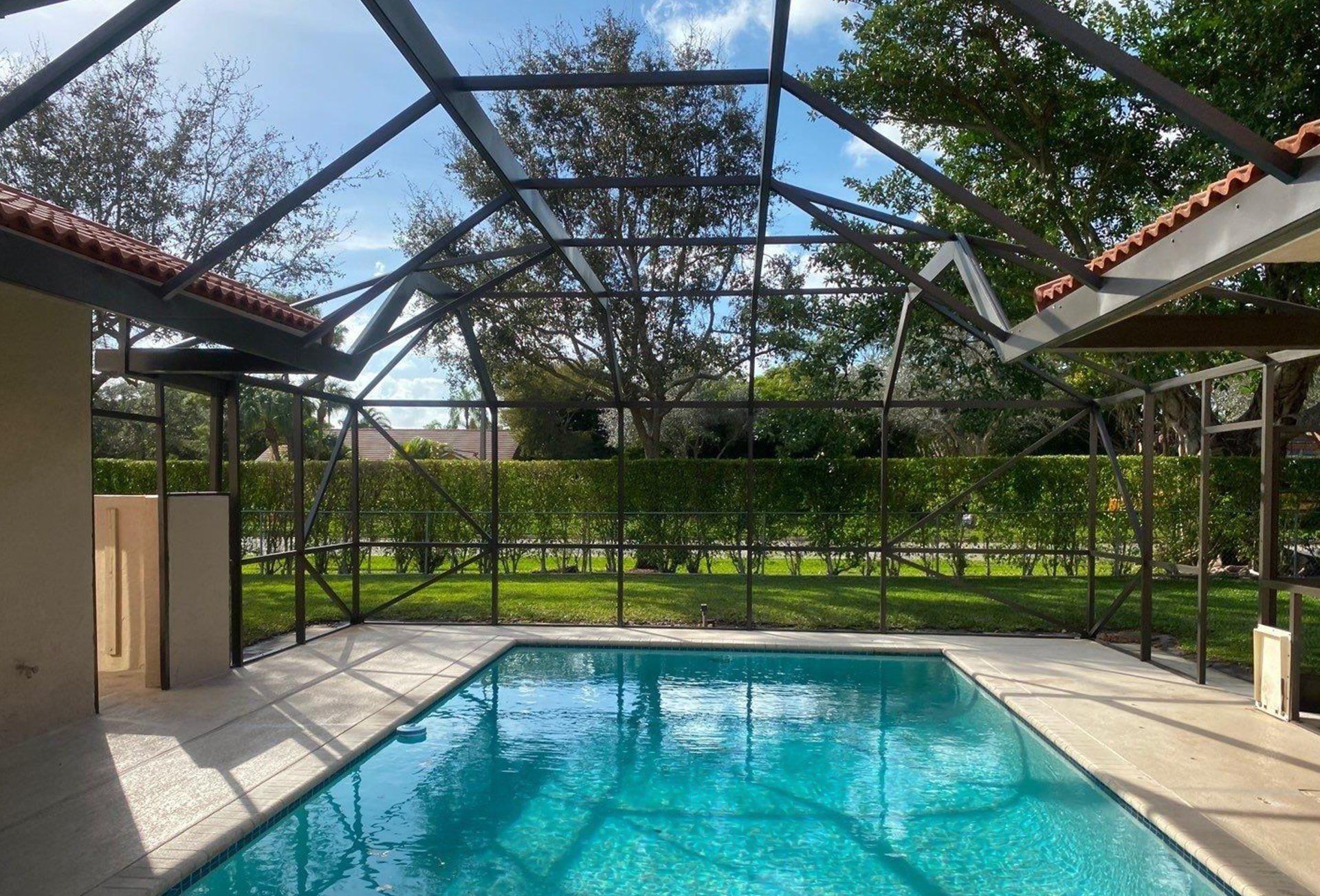 Pool enclosure in South Florida painted by Tru Colors Contracting