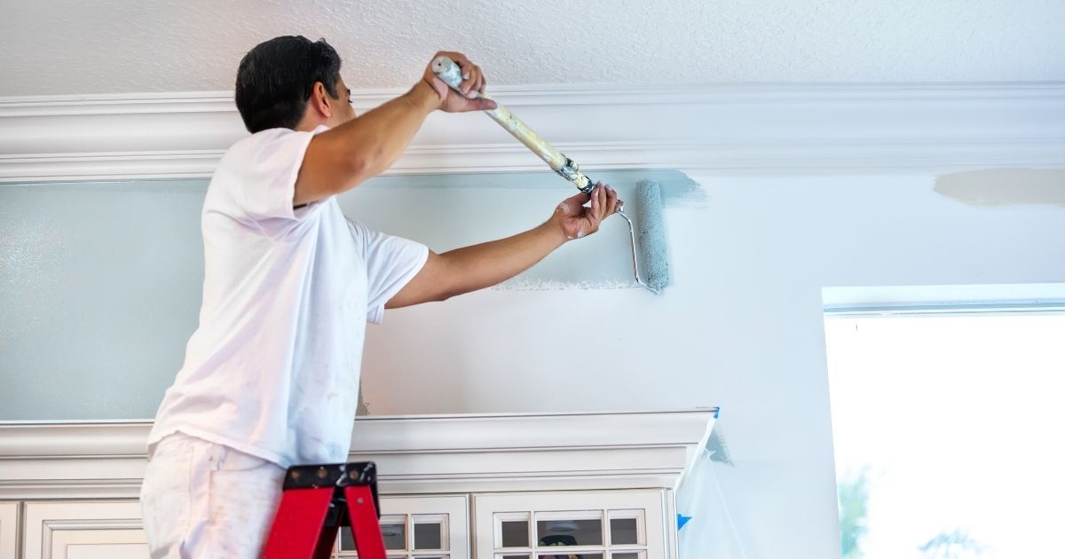 Person painting home in terior in south florida