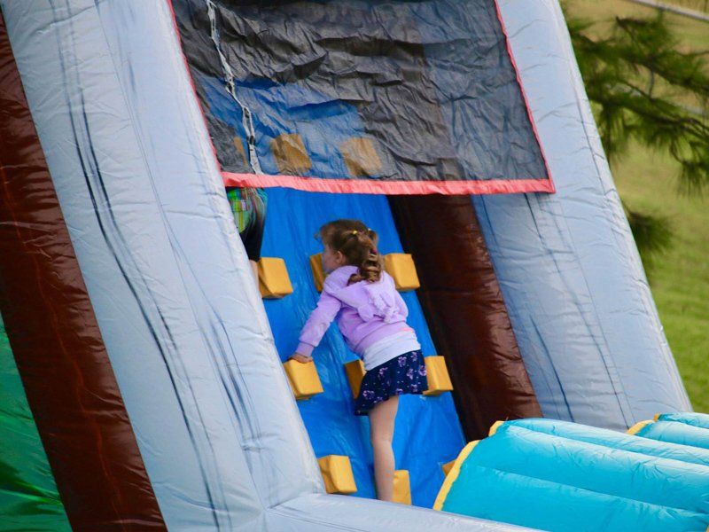 Girl climbing up the obstacle course — Inflatable Activities in Gympie, QLD