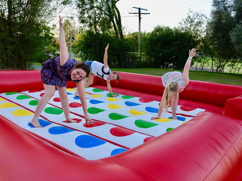 Friends playing twister — Inflatable Activities in Gympie, QLD