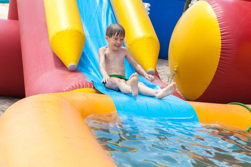 Boy in an inflatable pool — Waterslides in Gympie, QLD