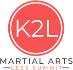 A red logo for martial arts lees summit