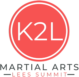 A red logo for martial arts lees summit