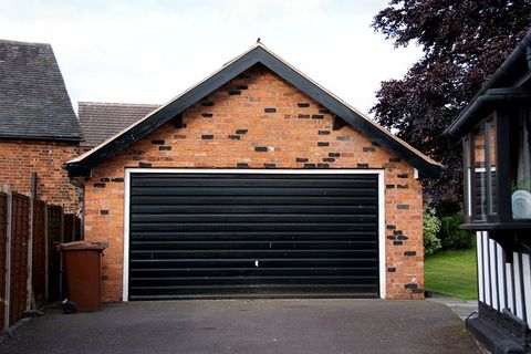 Garage Door Repair — House with Siding and Garage Door in Bartonville, IL