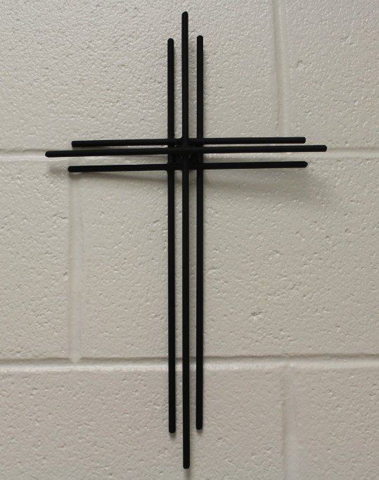 Iron cross on a wall.