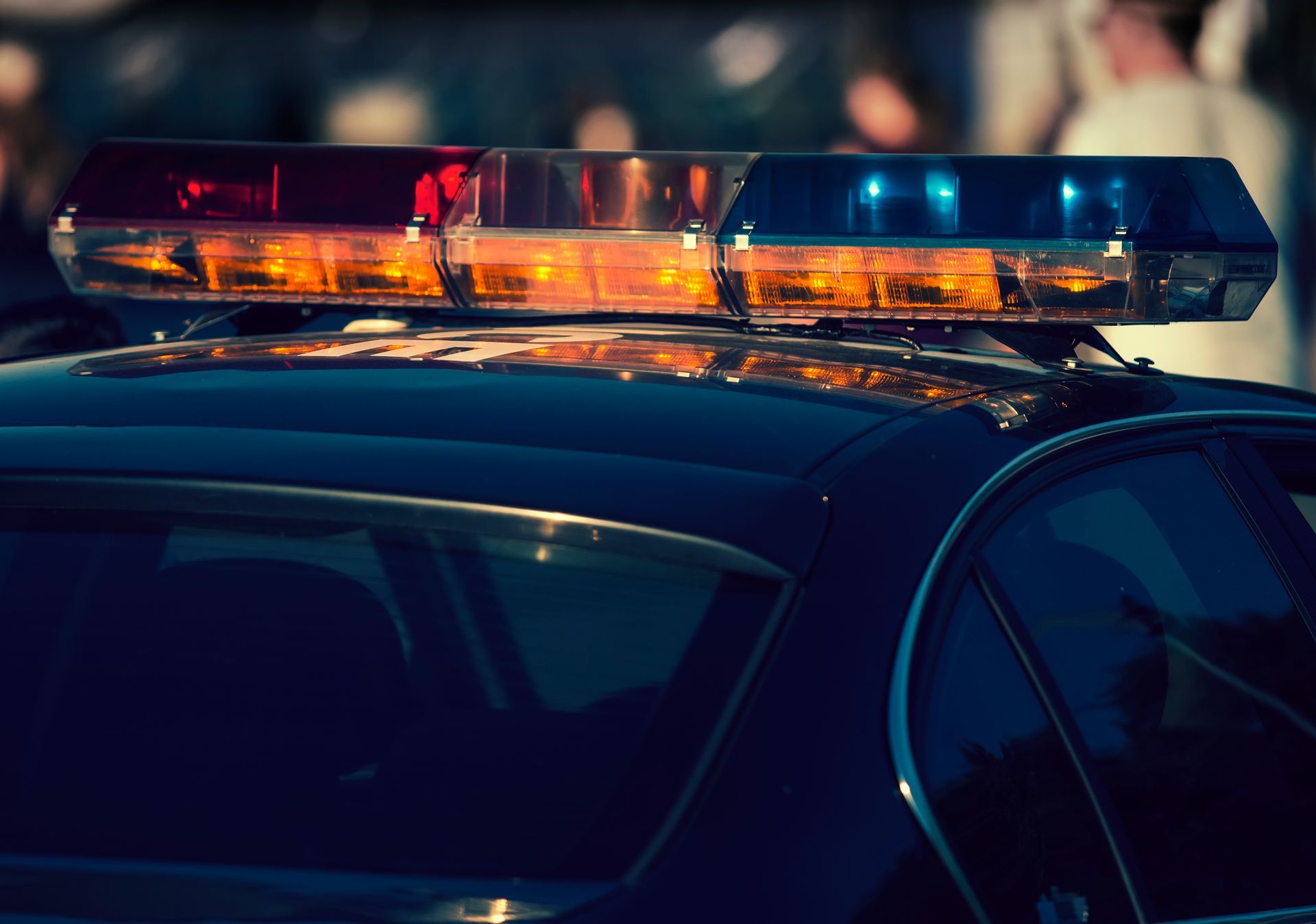 A police car with a bunch of lights on top of it.