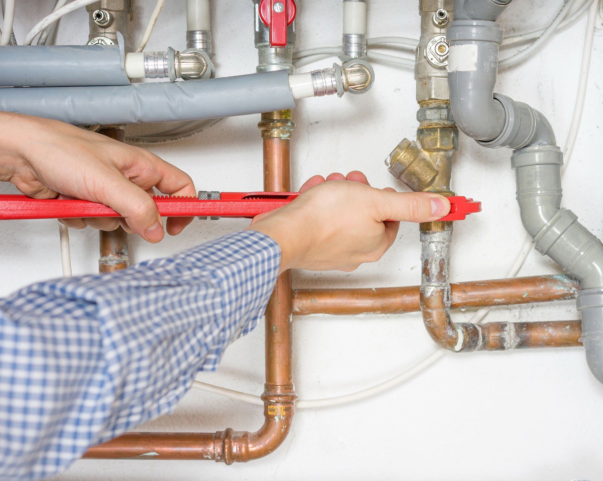 Water Heaters — Plumber Fixing Heating System in Spanish Fort, AL