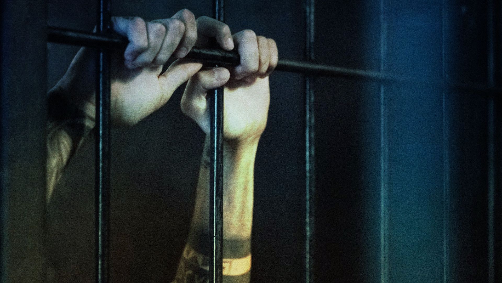 hands behind bars