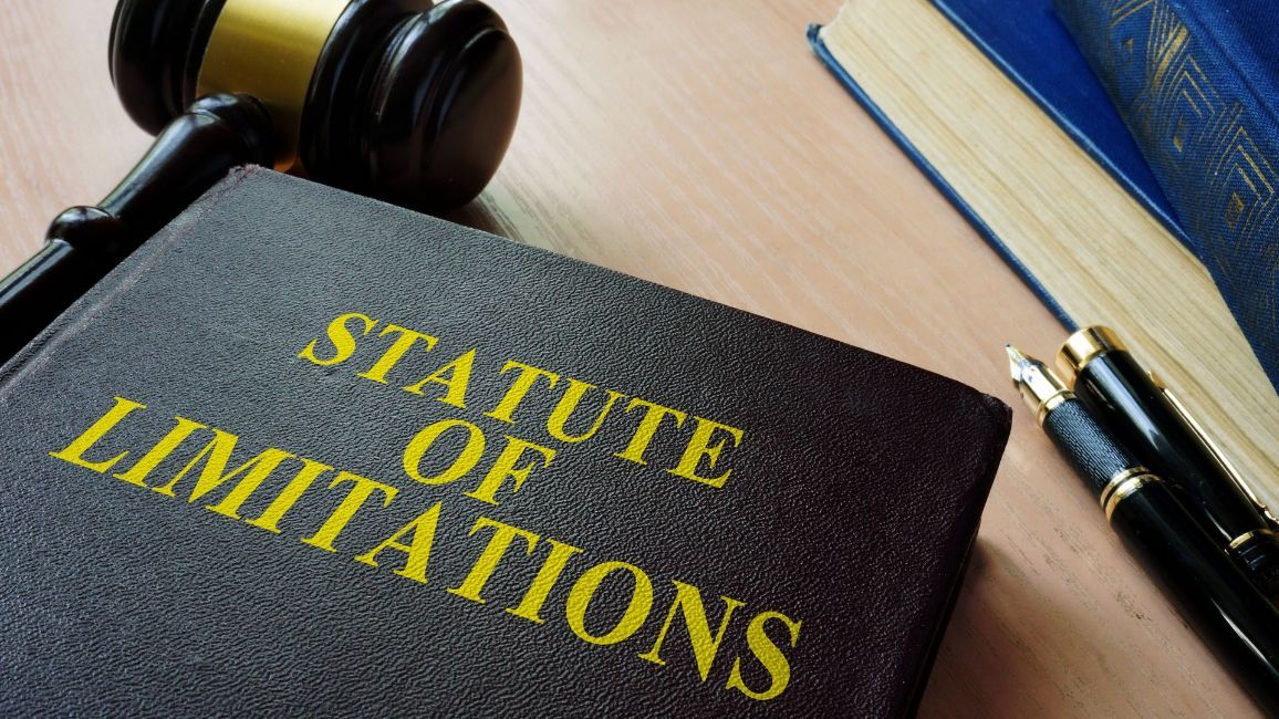 a statute of limitations book with a judge 's gavel on top of it