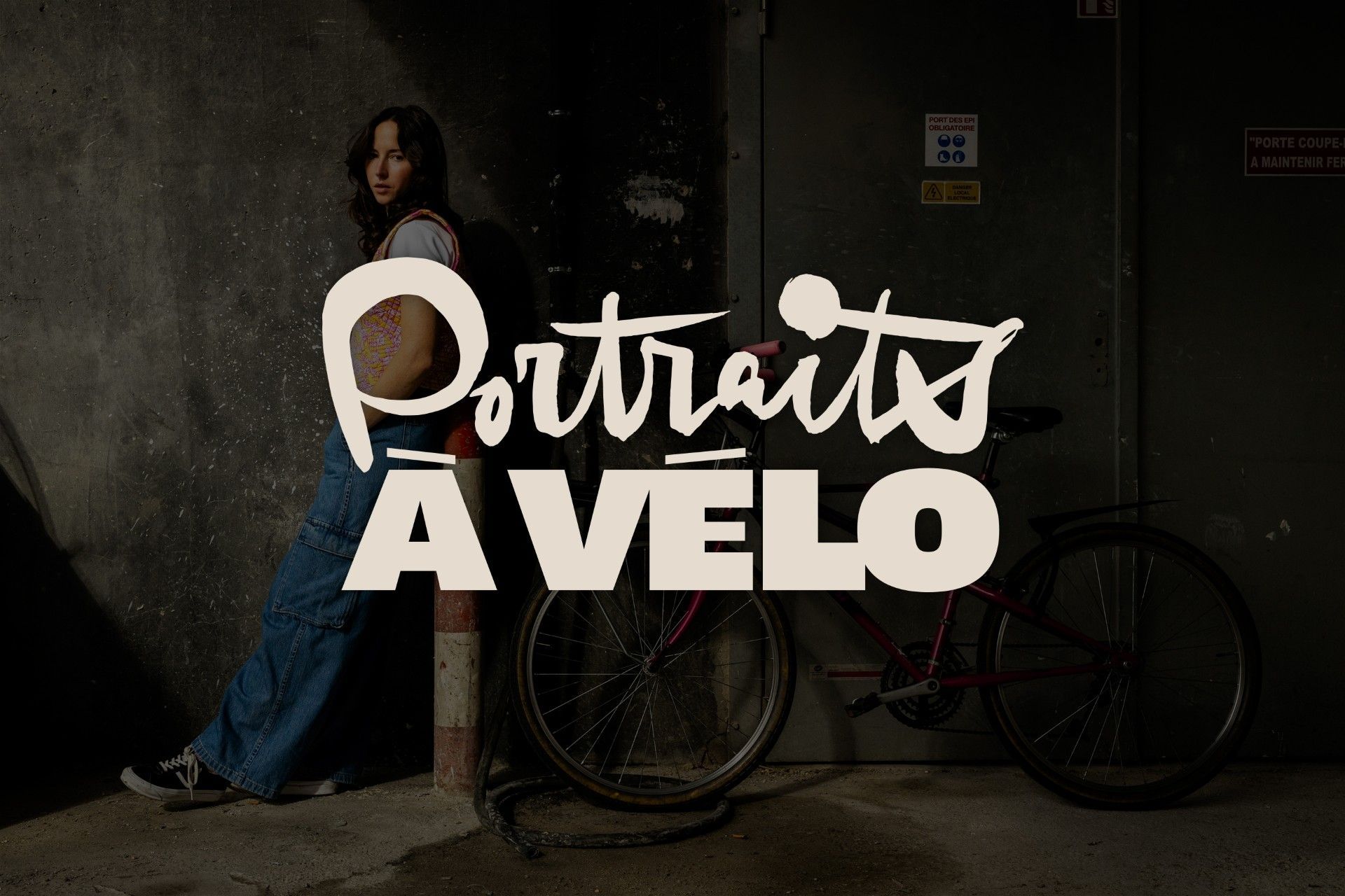 Person standing beside a bicycle in a dark setting with “Portraits AVELO” text overlay