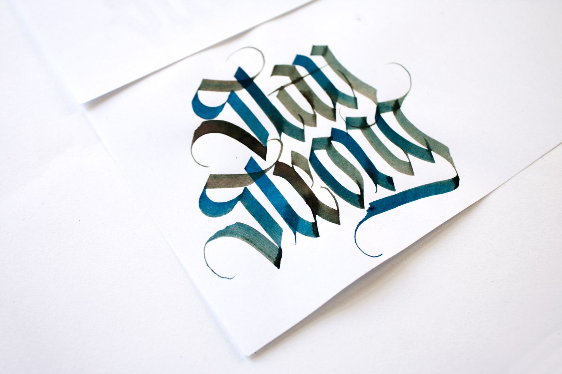 Blackletter artwork displaying the message ’Stay Strong’.