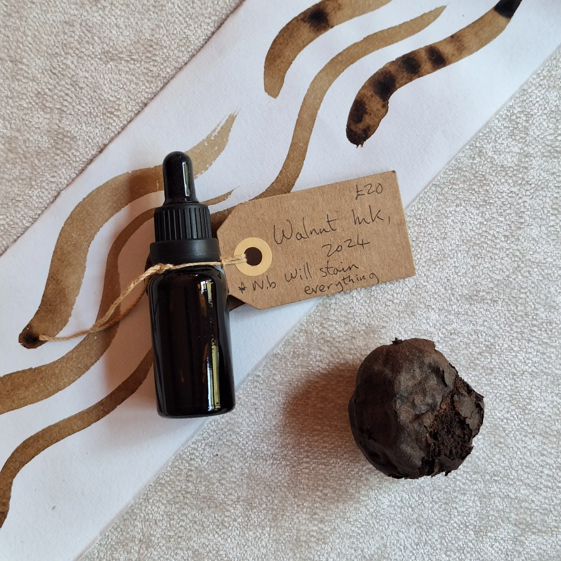A bottle of walnut ink with the tag