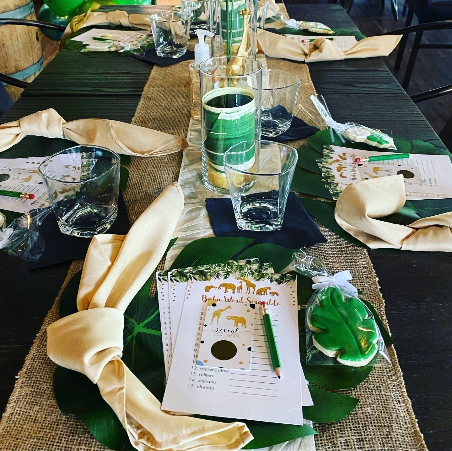 A table set up for a party with leaves on it
