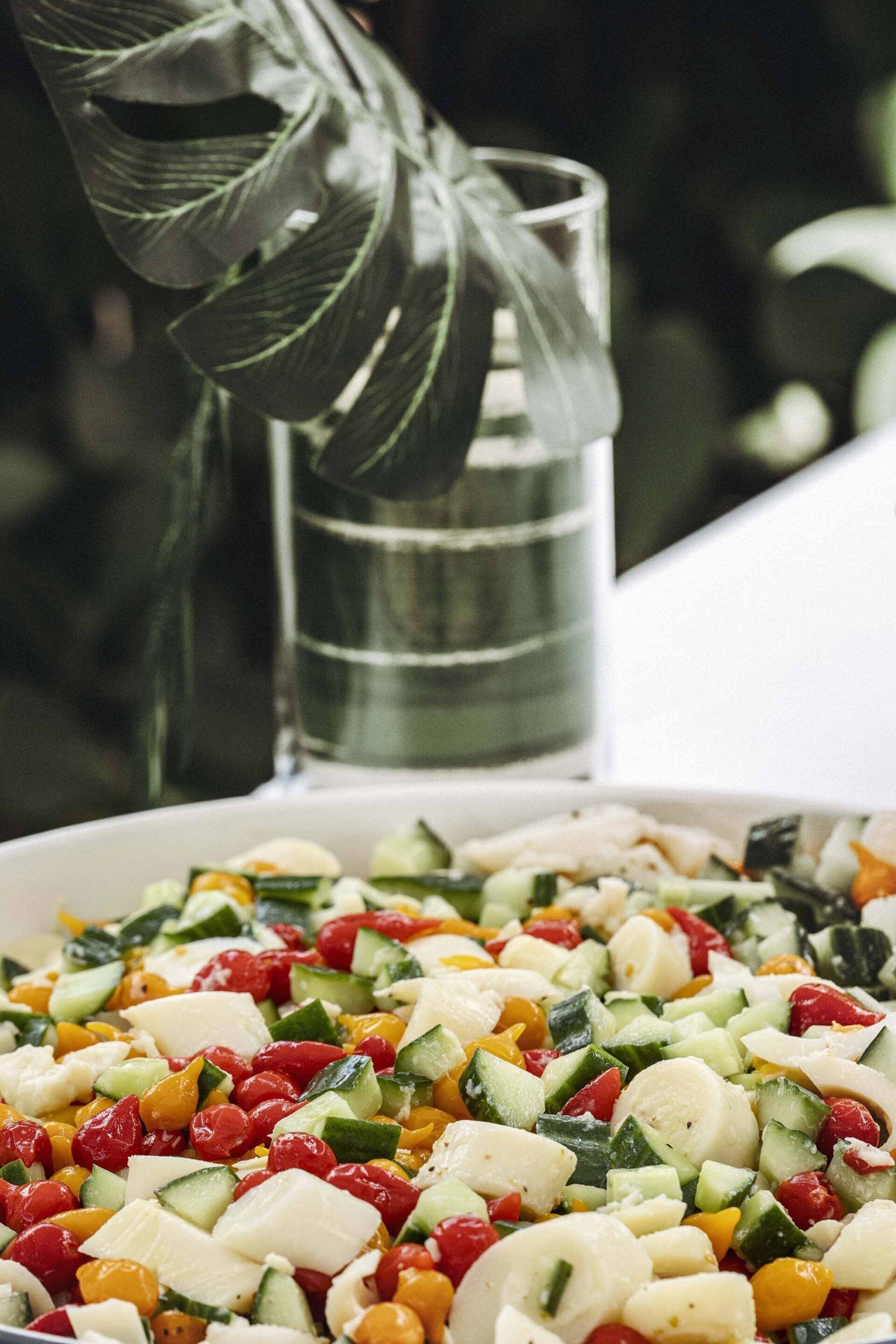 A close up of a salad in a bowl on a table.