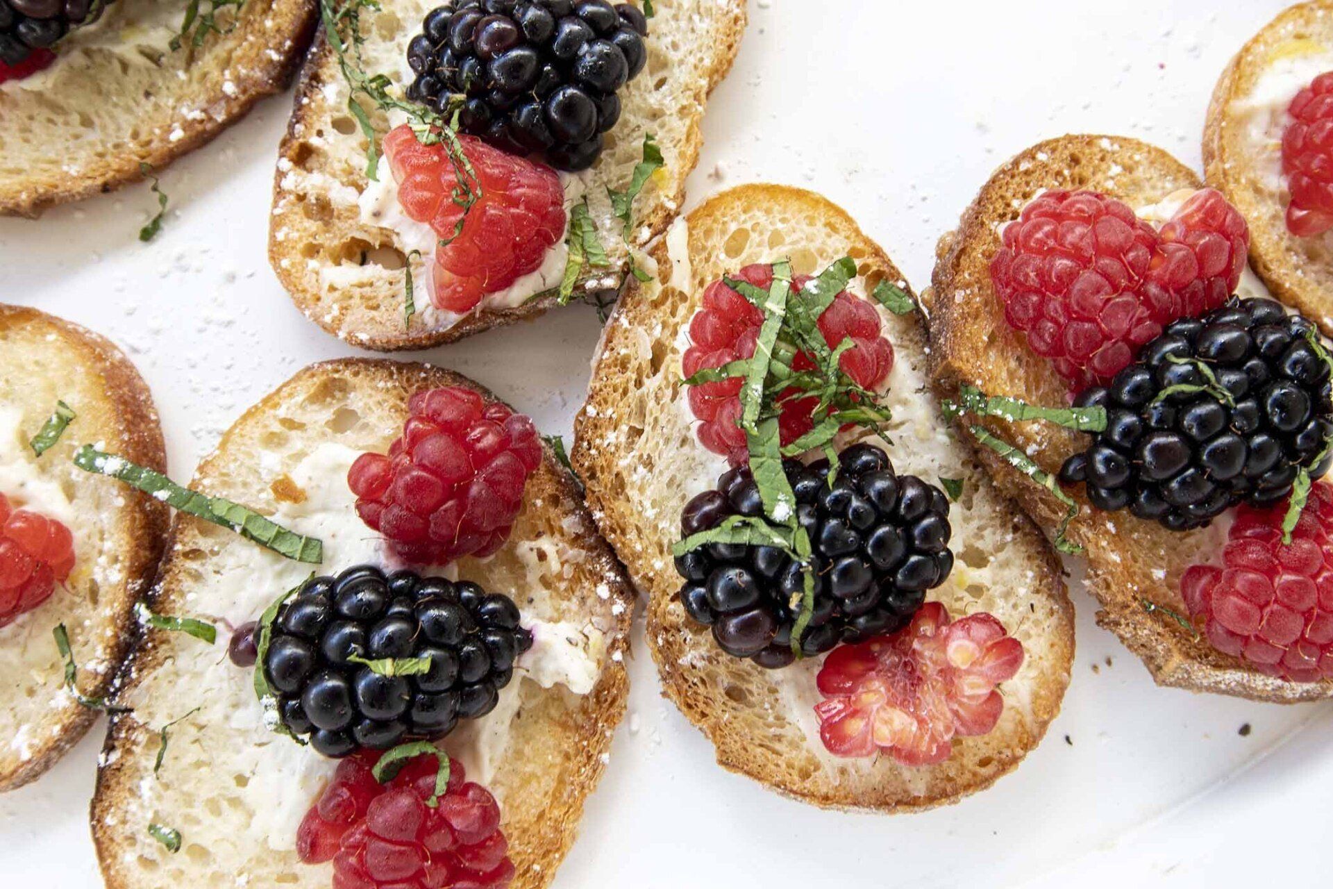 A close up of a plate of food with berries on it.
