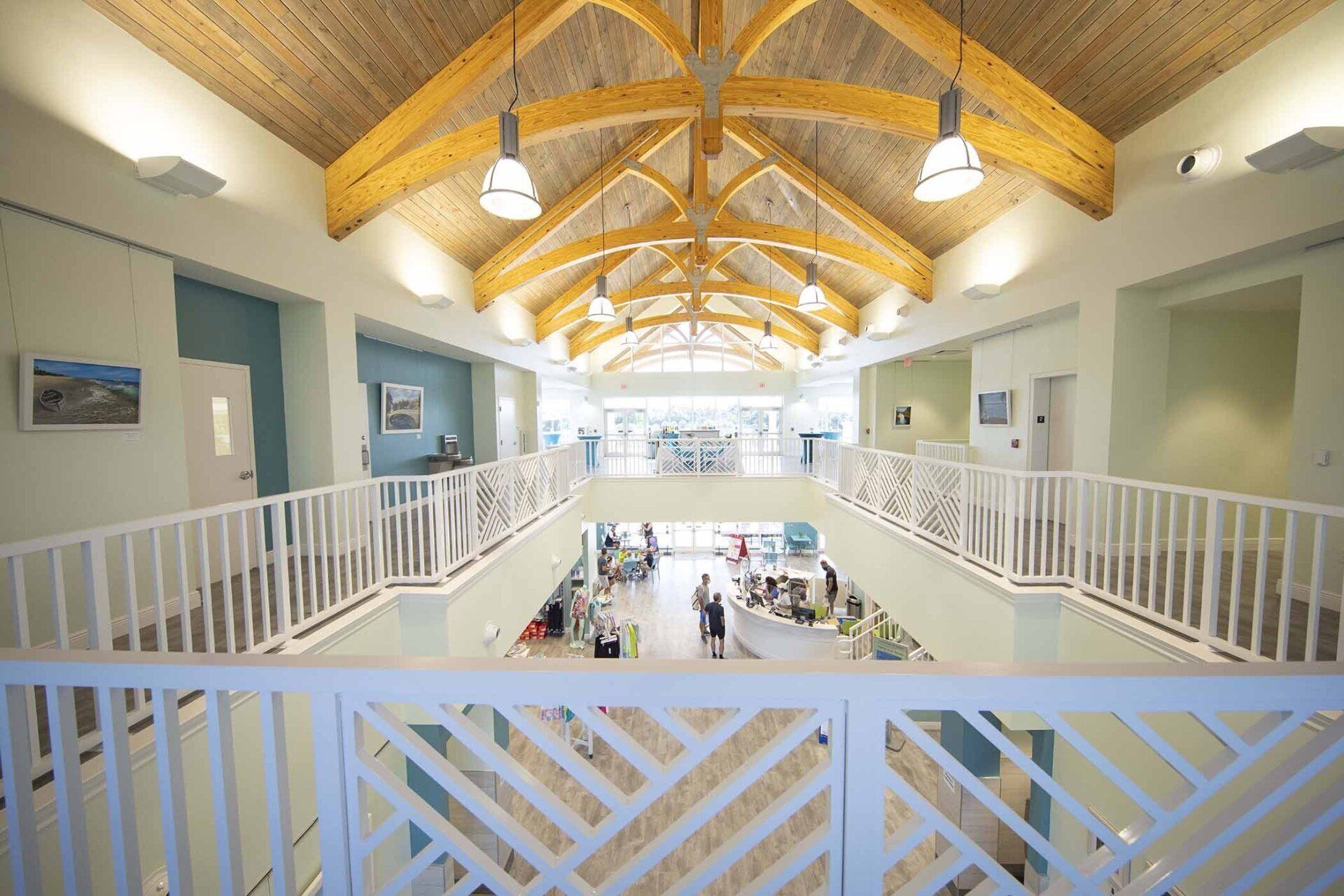 The inside of a building with a balcony and a wooden ceiling.