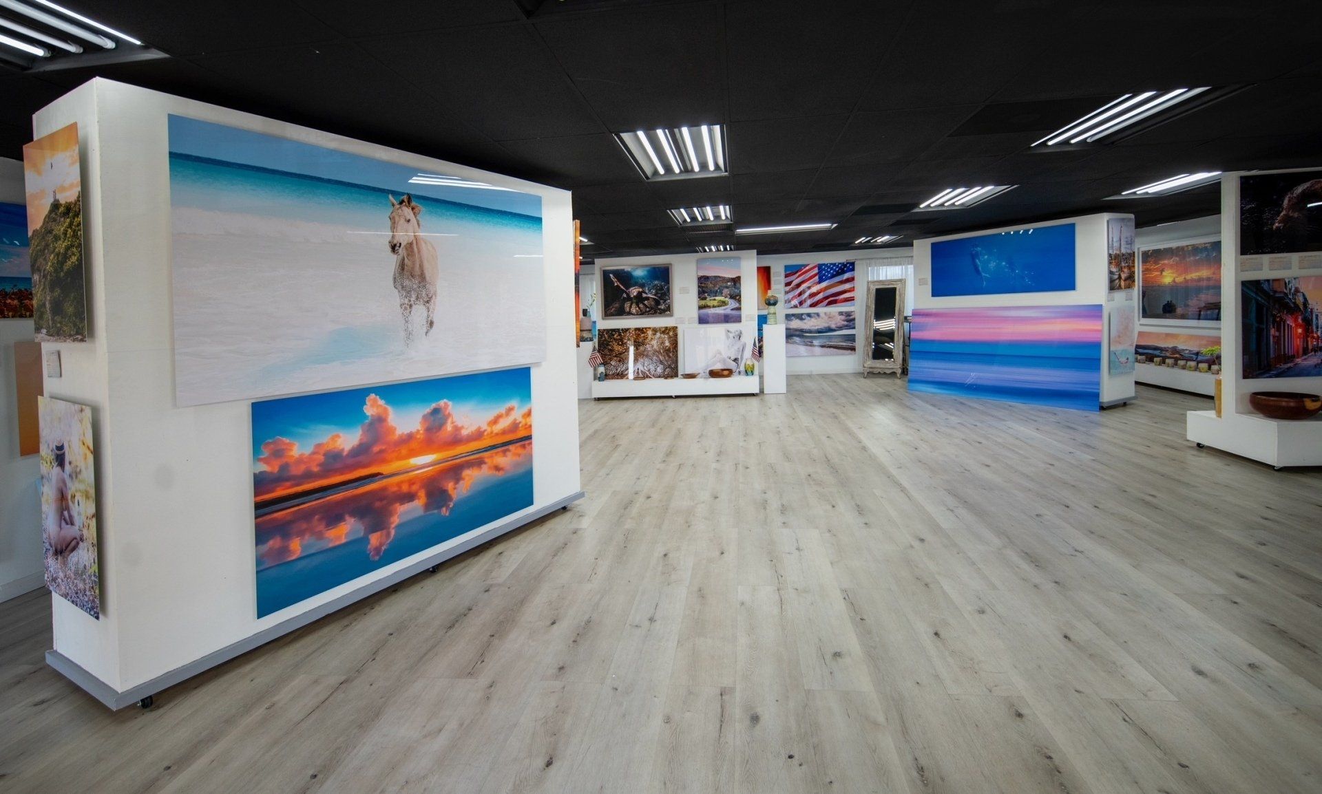 A large room with a lot of paintings on the wall.