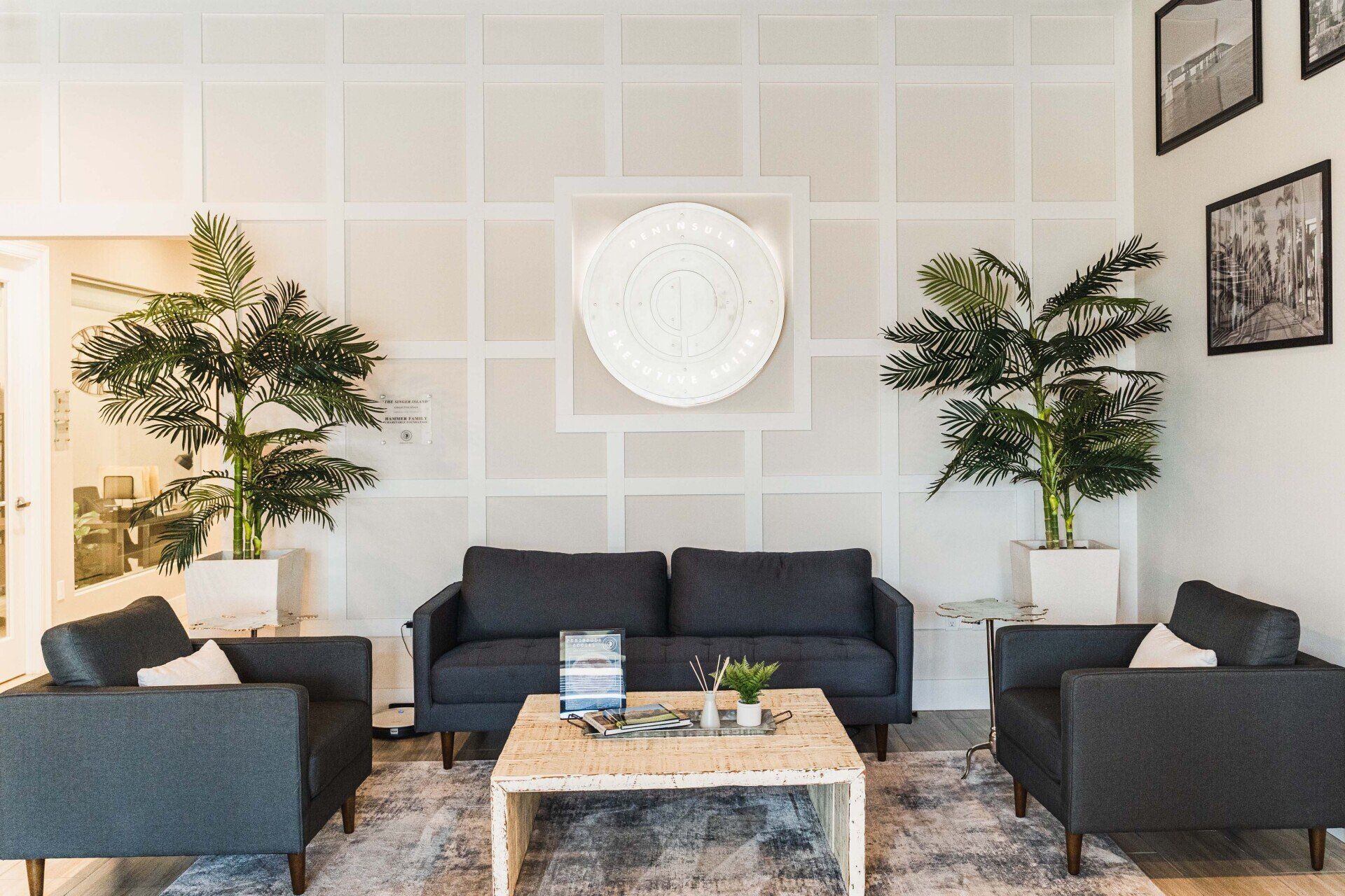 A living room with a couch , chairs , and a coffee table.