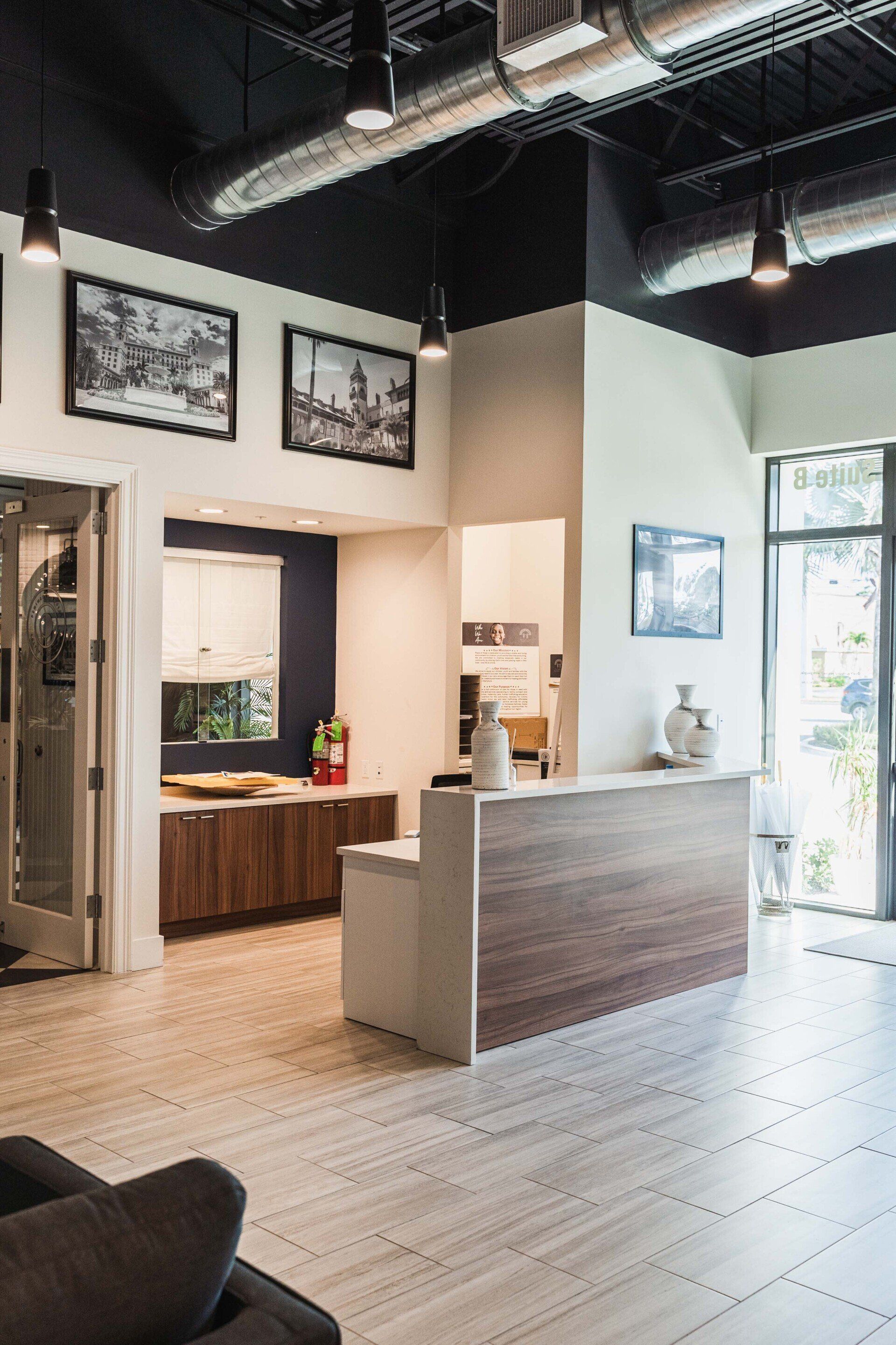 A living room with a wooden counter and a couch.