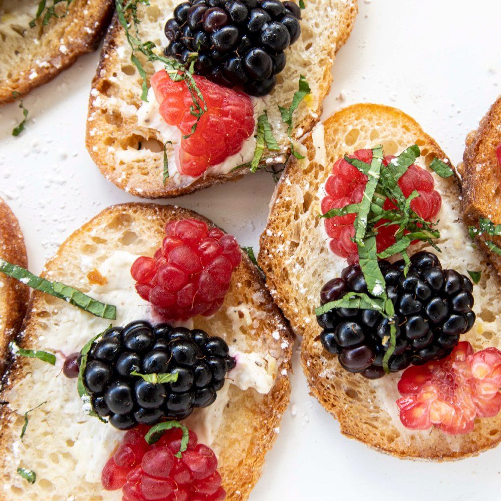 A close up of a plate of food with berries on it.
