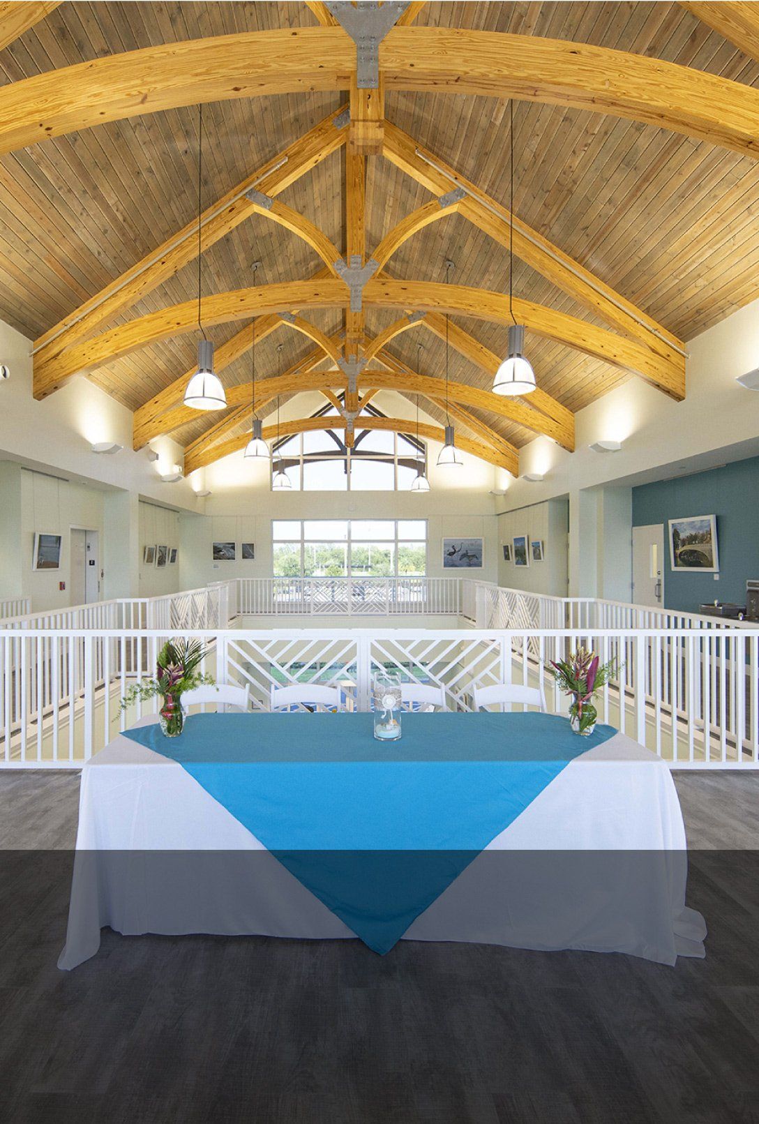 There is a table with a blue tablecloth in the middle of the room.