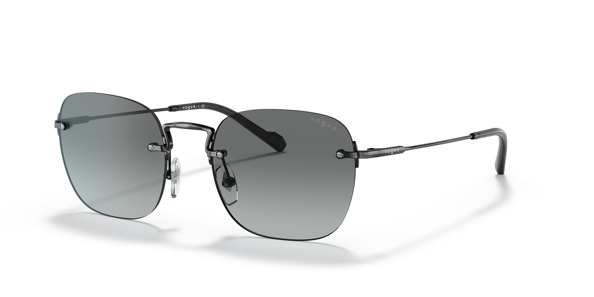 A pair of sunglasses is sitting on a white surface.