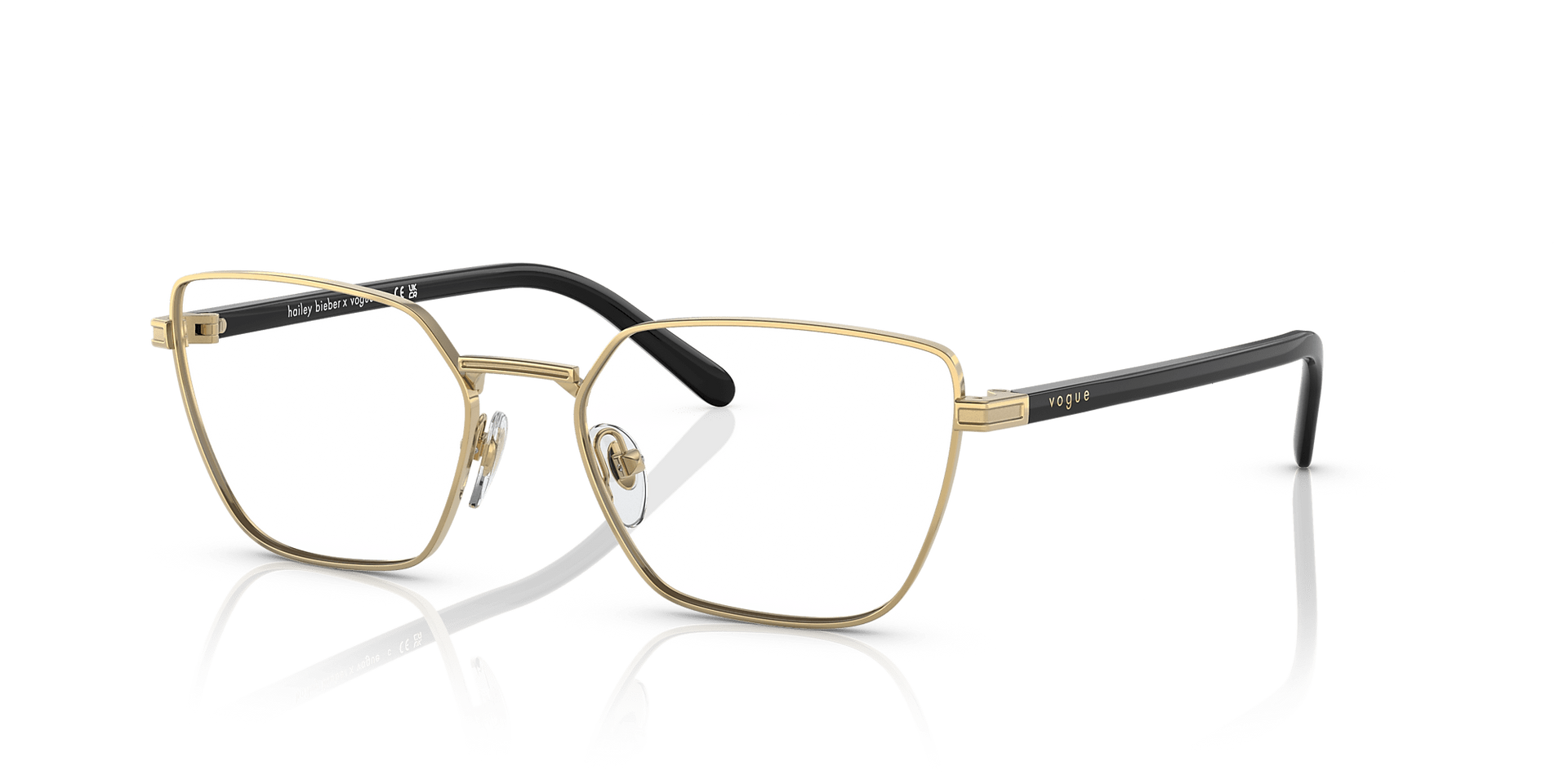 A pair of glasses with a gold frame on a white background.